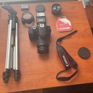Canon Camera (New) Multiple lenses , tripod , extra battery , digital UV filter